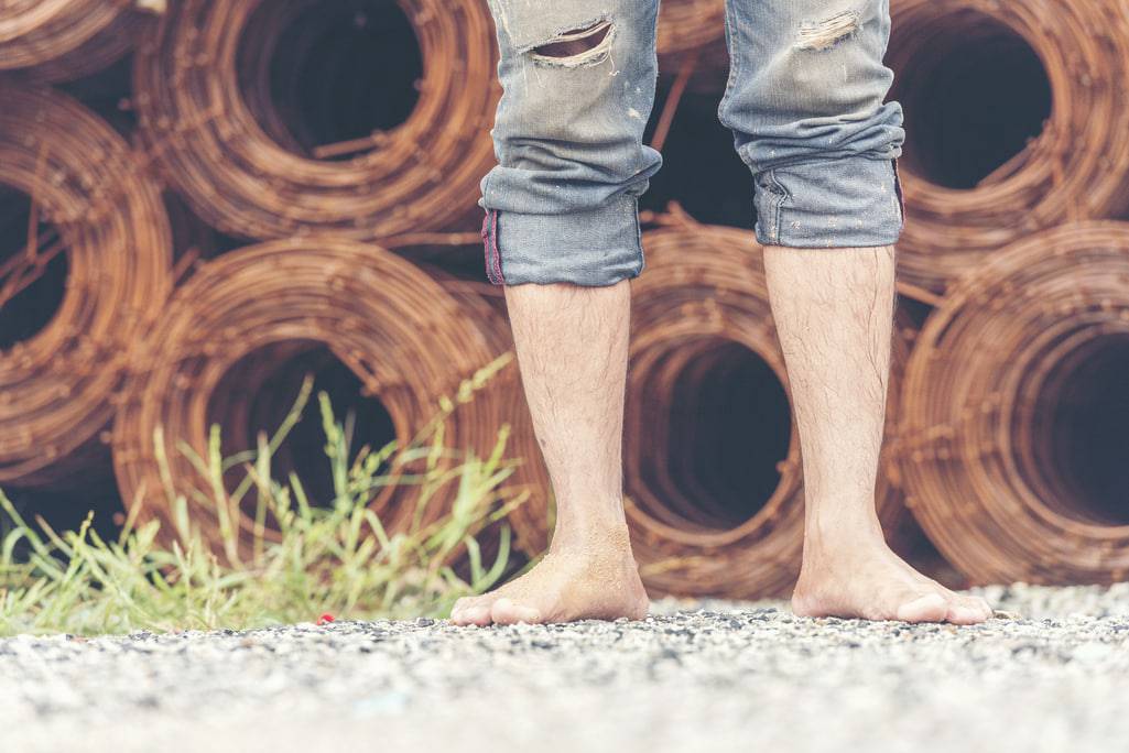 man barefoot walking